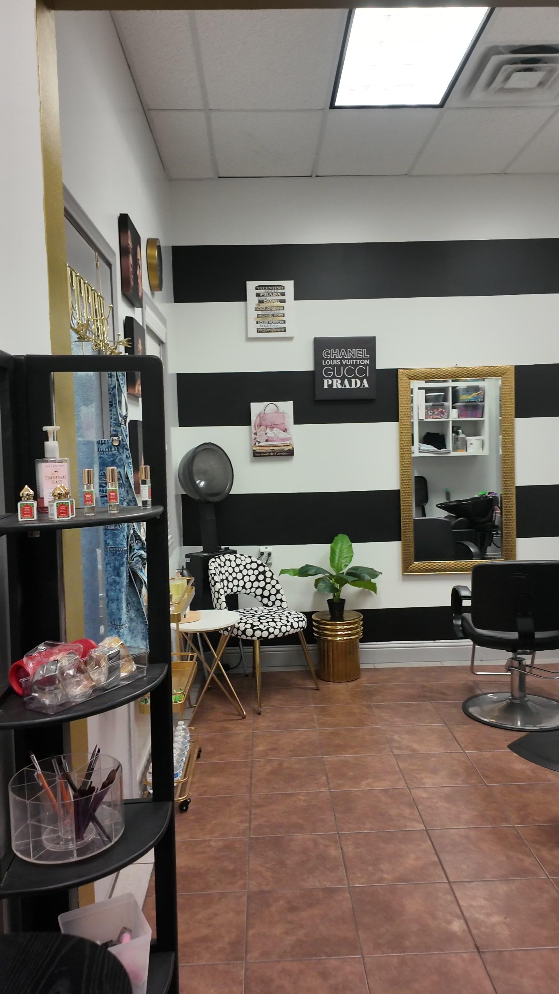 Chic salon suite with black and white striped walls and designer decor